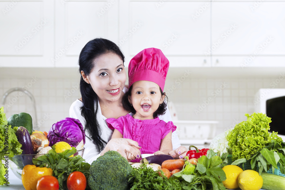 Mother and daughter preparing salad Mother and daughter preparing salad