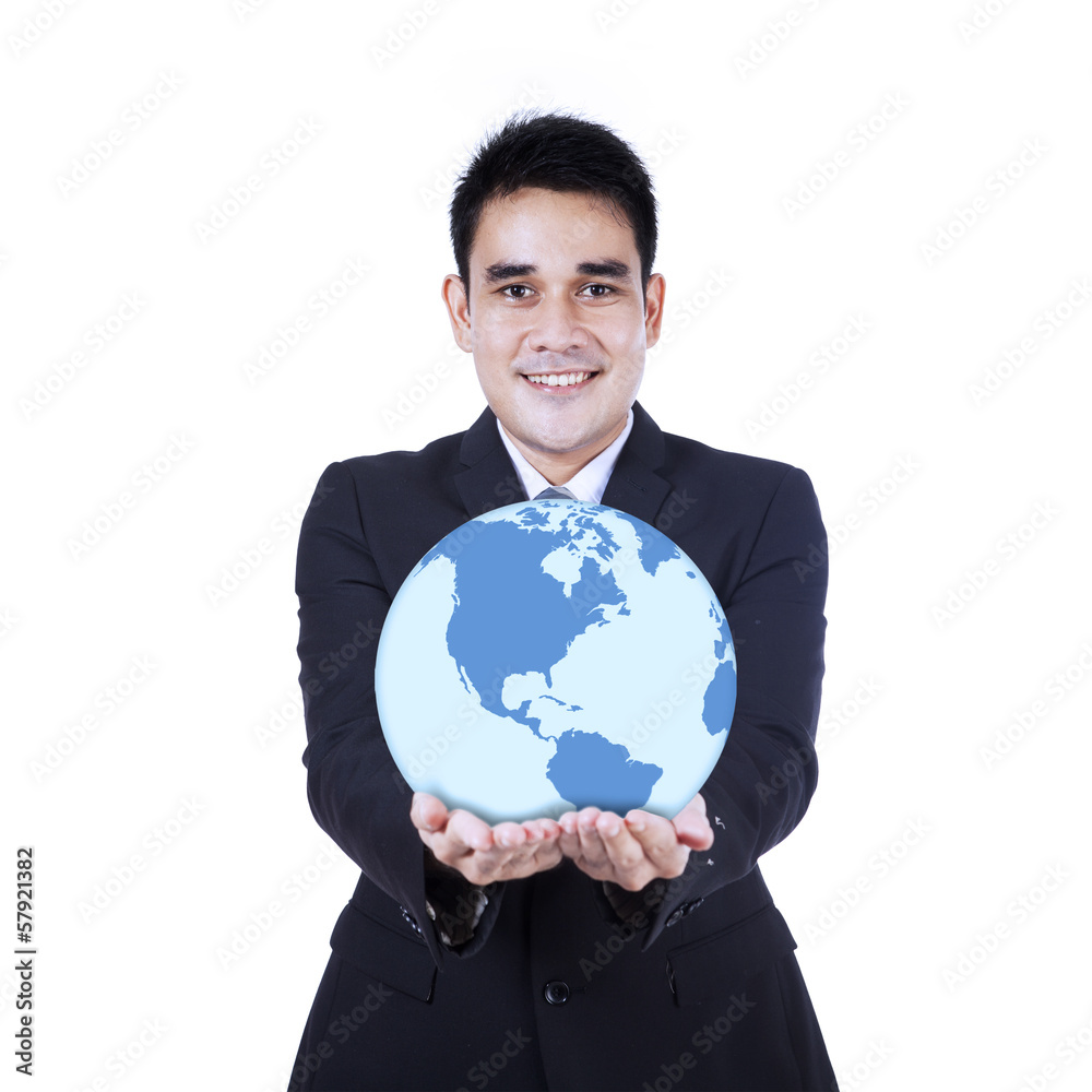 Smiling businessman holding a globe Smiling businessman holding a globe