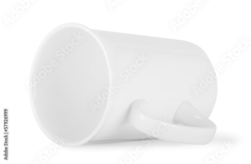 White cup lying on its side photo