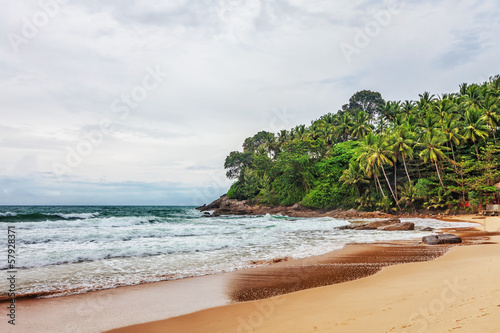 tropical beach under gloomy sky