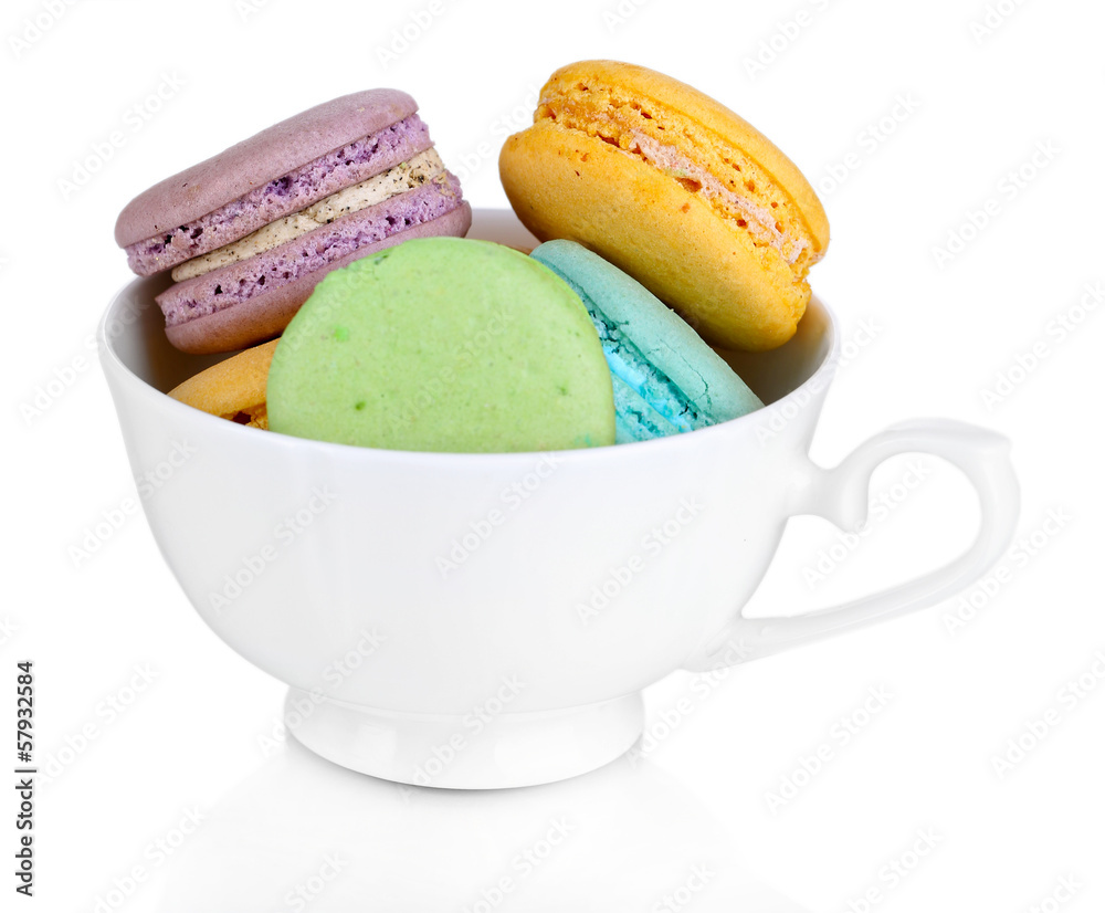 Macaroons in cup isolated on white Macaroons in cup isolated on white