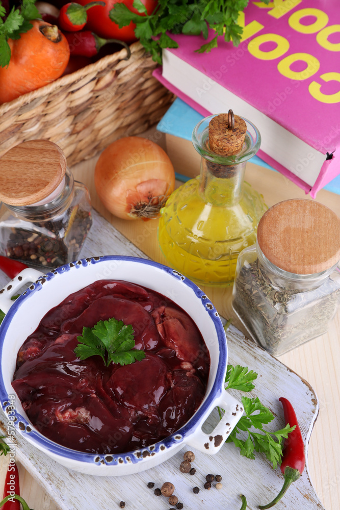 Raw liver in pan with spices and condiments Raw liver in pan with spices and condiments