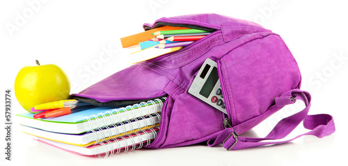 Fotografie Purple backpack with school supplies isolated on white