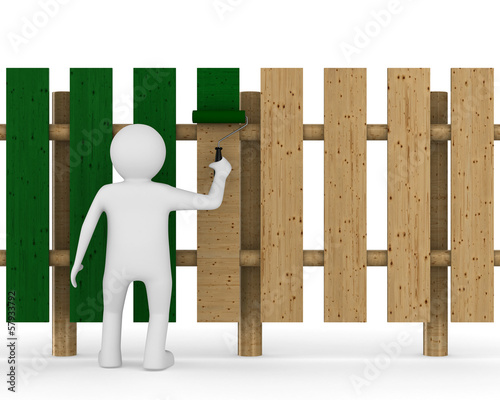 man paints fence on white b...
