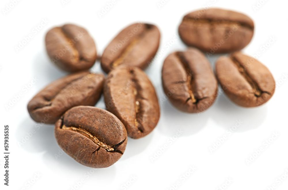 Macro of coffee beans isolated on white background Macro of coffee beans isolated on white background