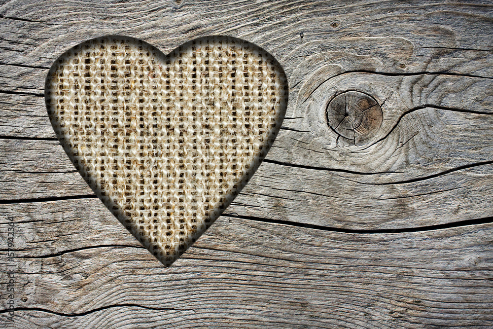 Background with a hole in the shape of heart and old wooden boar Background with a hole in the shape of heart and old wooden boar
