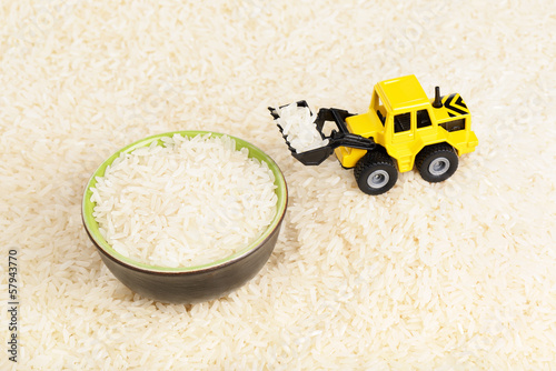 Industrial tractor toy load rice to plate photo