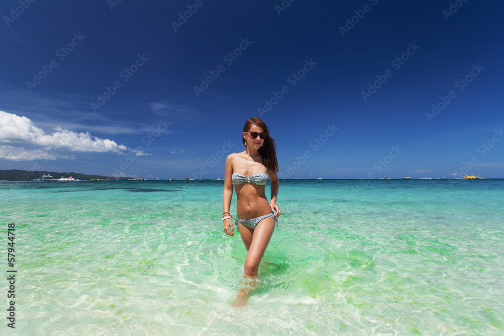Woman posing on the beach