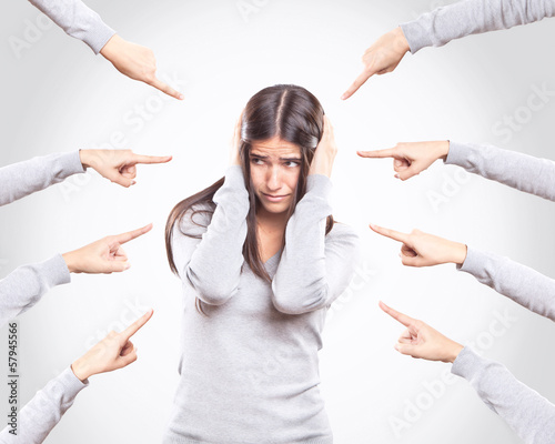 Worried young woman being accused