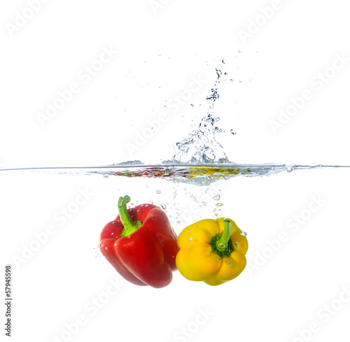Two Fresh Red and Yellow Paprika Splash in Water