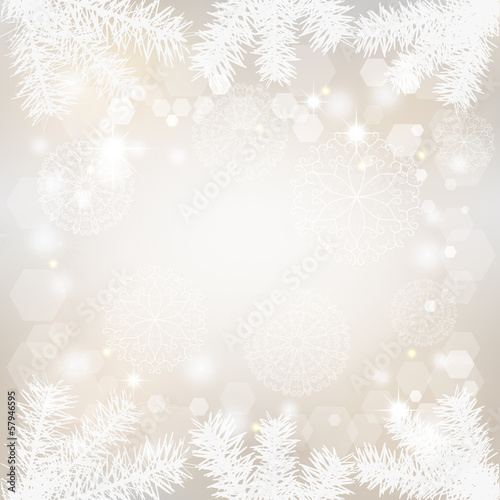 Christmas background with lacy snowflakes and fir branches