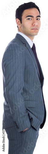 Unsmiling businessman standing