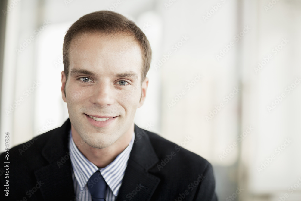 Portrait of smiling businessman, head and shoulders Portrait of smiling businessman, head and shoulders