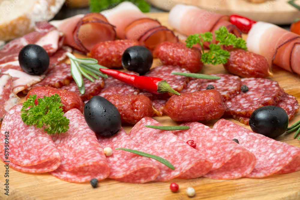 Assorted meats and sausages, close-up, selective focus Assorted meats and sausages, close-up, selective focus