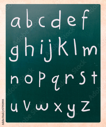 Complete english alphabet handwritten with white chalk on a blac