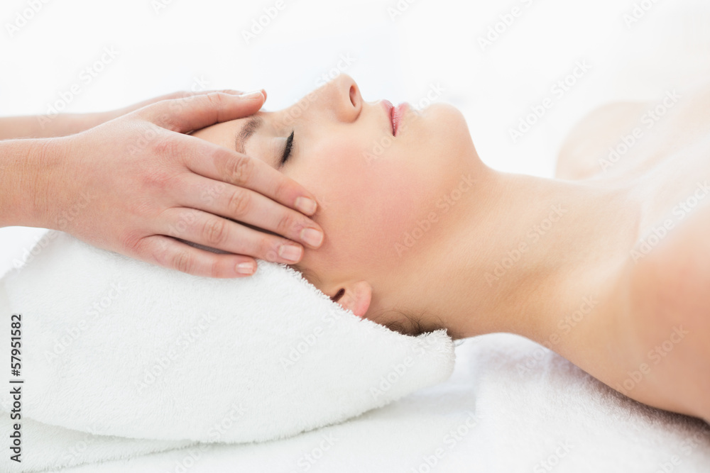 Hands massaging a beautiful woman's forehead Hands massaging a beautiful woman's forehead