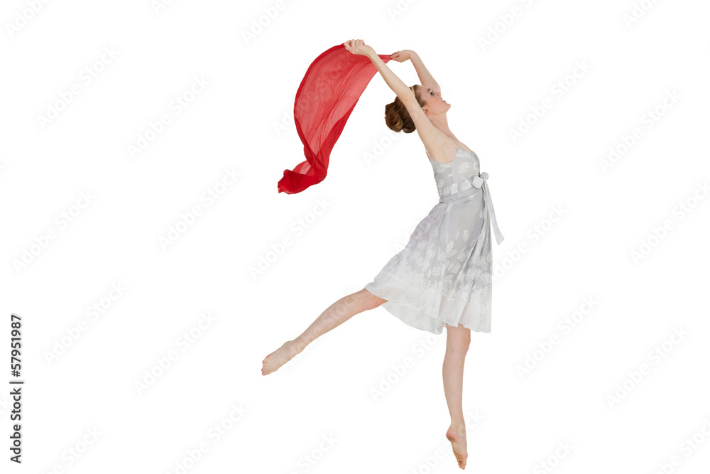 Obraz premium Young beautiful female dancer with red scarf