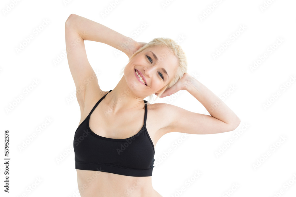 Toned sporty woman smiling over white background Toned sporty woman smiling over white background