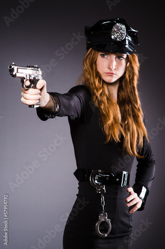 Woman police office with gun