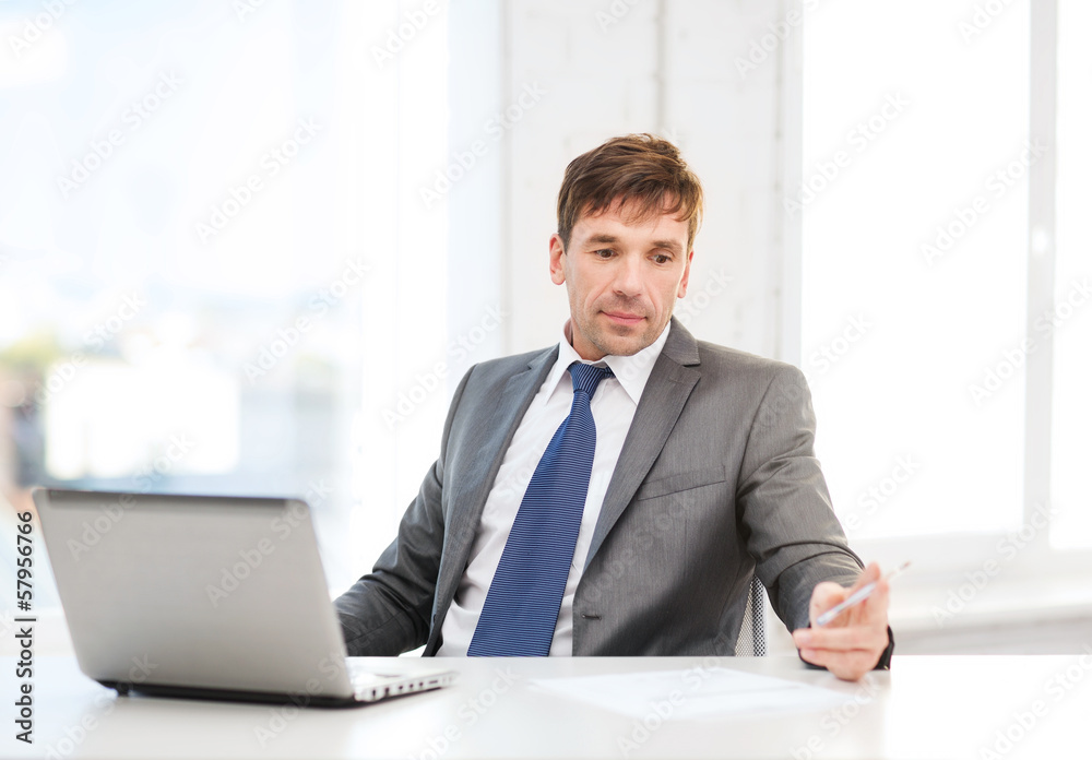 businessman with laptop computer and documents businessman with laptop computer and documents
