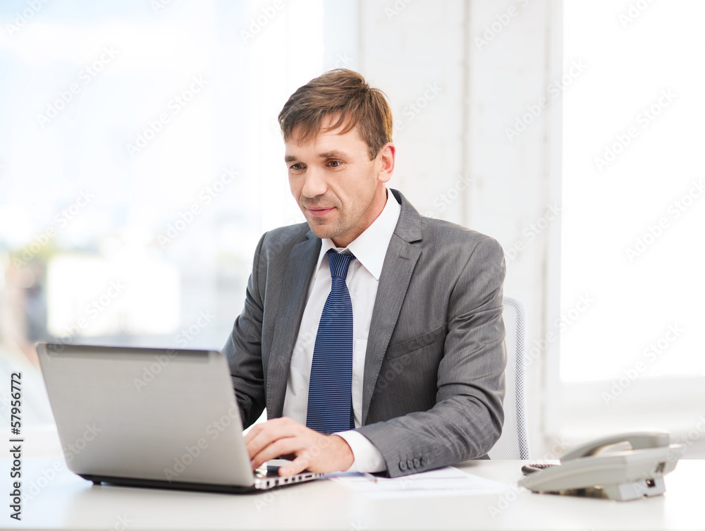 businessman with laptop computer and documents businessman with laptop computer and documents