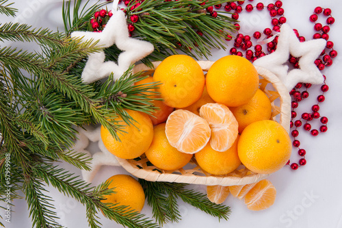Christmas decoration with mandarins and fir tree