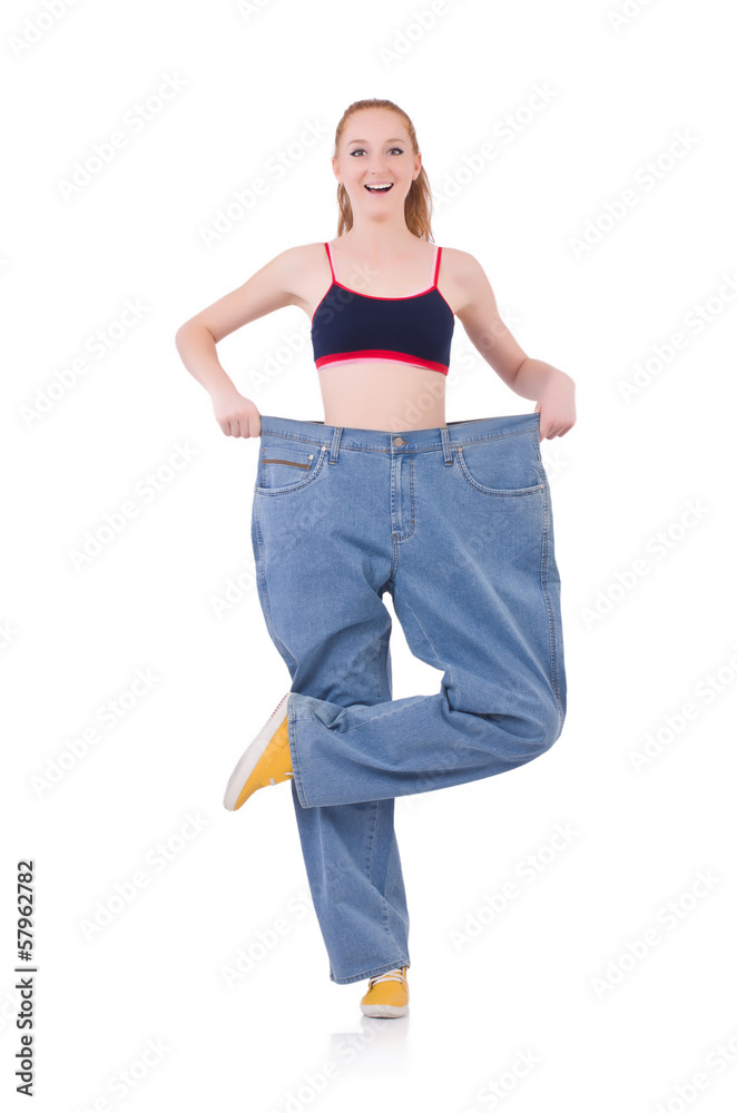 Woman with large jeans in dieting concept Woman with large jeans in dieting concept