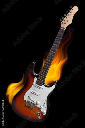 electric guitar on fire isolated on black