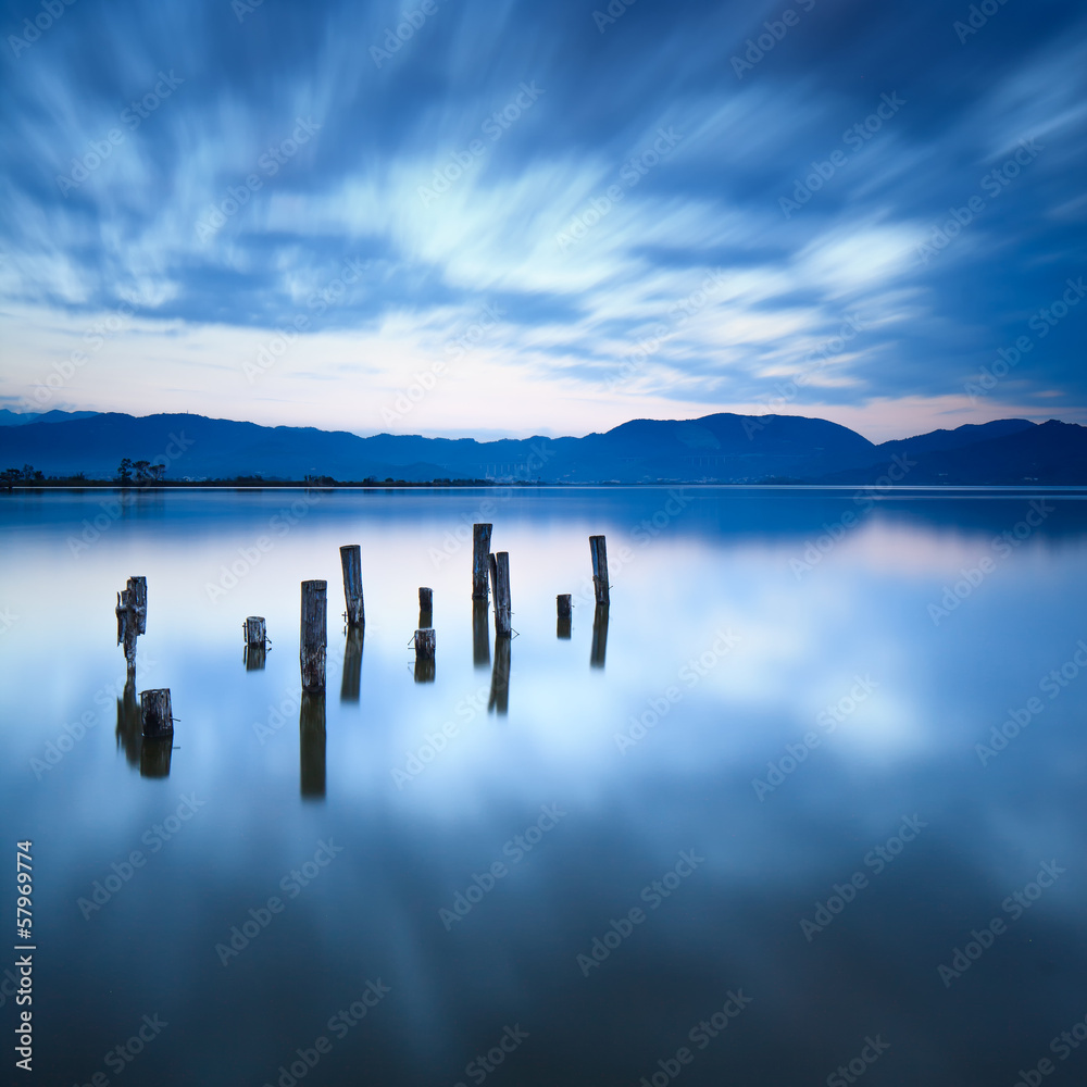 Wooden pier or jetty remains on a lake. Versilia Tuscany, Italy