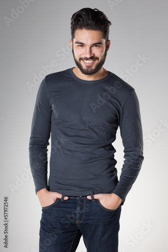 attractive sexy man with beard dressed casual smiling