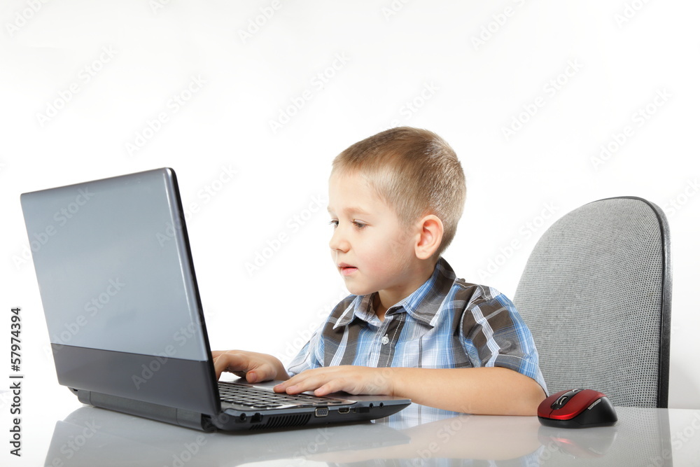 Computer addiction child with laptop notebook Computer addiction child with laptop notebook
