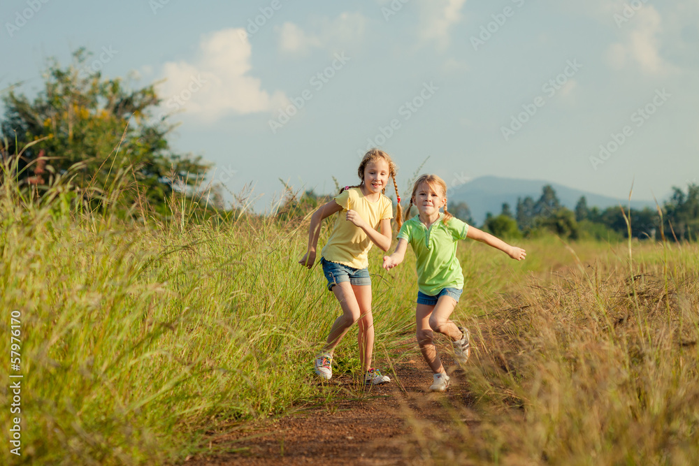 two girls running on the road two girls running on the road