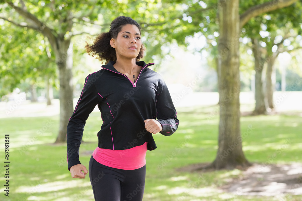 Beautiful healthy young woman jogging in the park Beautiful healthy young woman jogging in the park