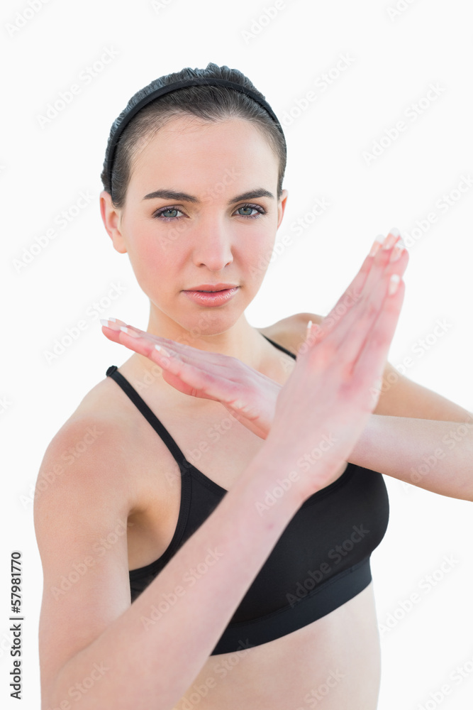 Fit young woman standing in defending posture Fit young woman standing in defending posture
