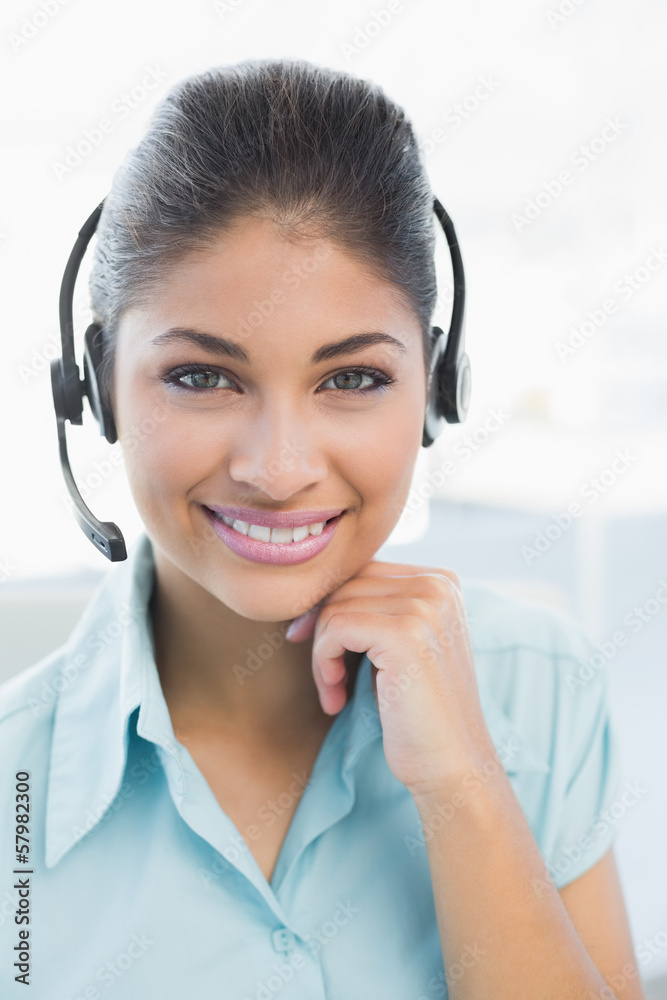 Close up of a businesswoman wearing headset Close up of a businesswoman wearing headset