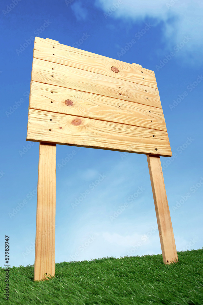 Wooden sign under the blue sky Wooden sign under the blue sky