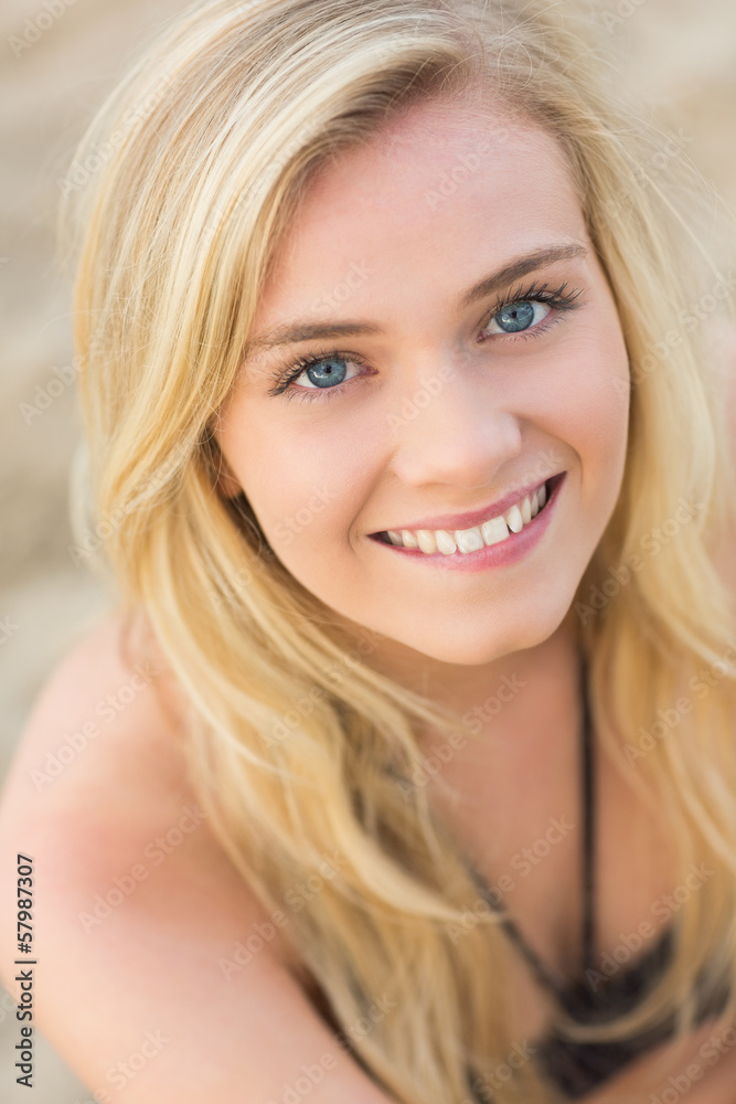Overhead Close up portrait of smiling blond at beach Overhead Close up portrait of smiling blond at beach