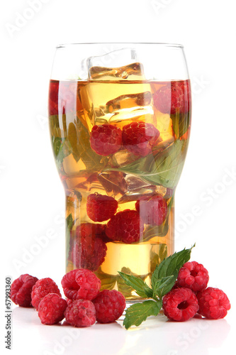 Iced tea with raspberries and mint isolated on white