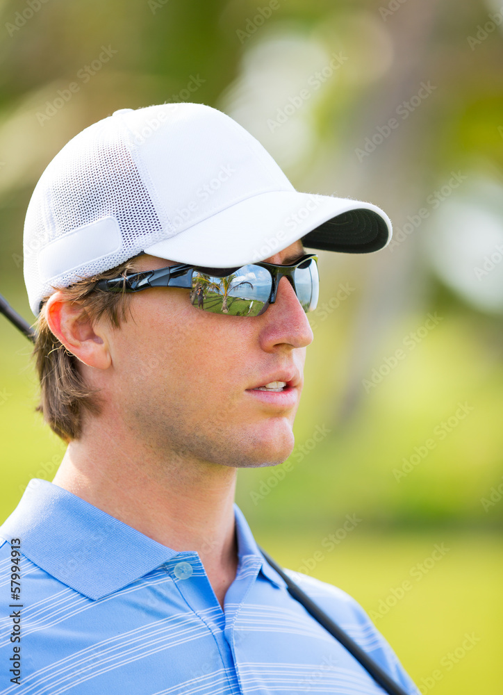 Athletic young man playing golf Athletic young man playing golf