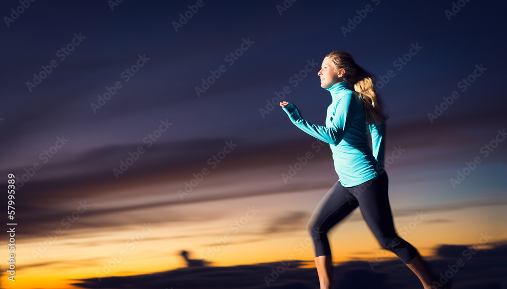 Athletic woman running at sunset dusk with motion blur Athletic woman running at sunset dusk with motion blur
