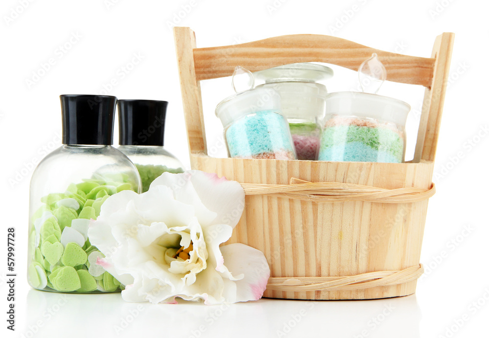 Aromatic salts in glass bottles, in wooden bucket, isolated Aromatic salts in glass bottles, in wooden bucket, isolated