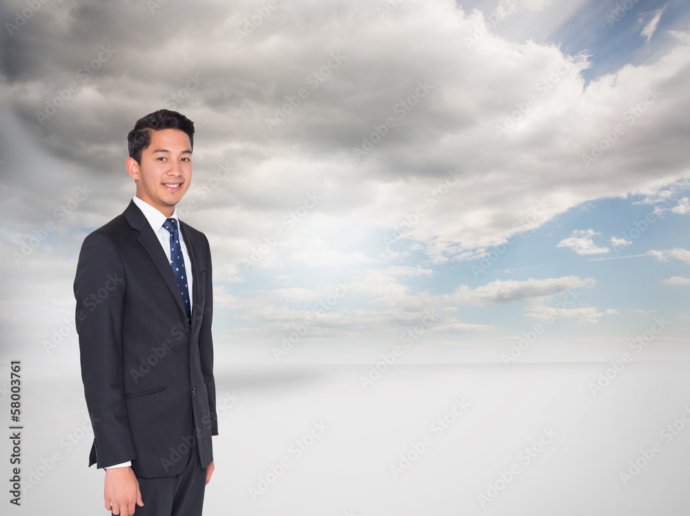 Composite image of smiling businessman looking at camera Composite image of smiling businessman looking at camera