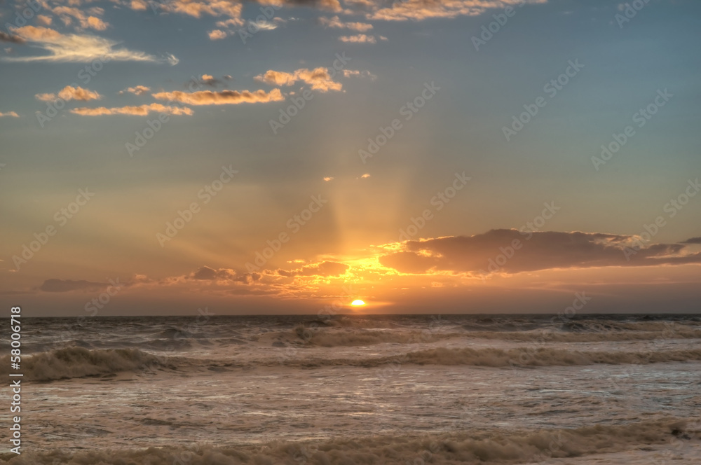 rays of sun on a seashore at dusk rays of sun on a seashore at dusk