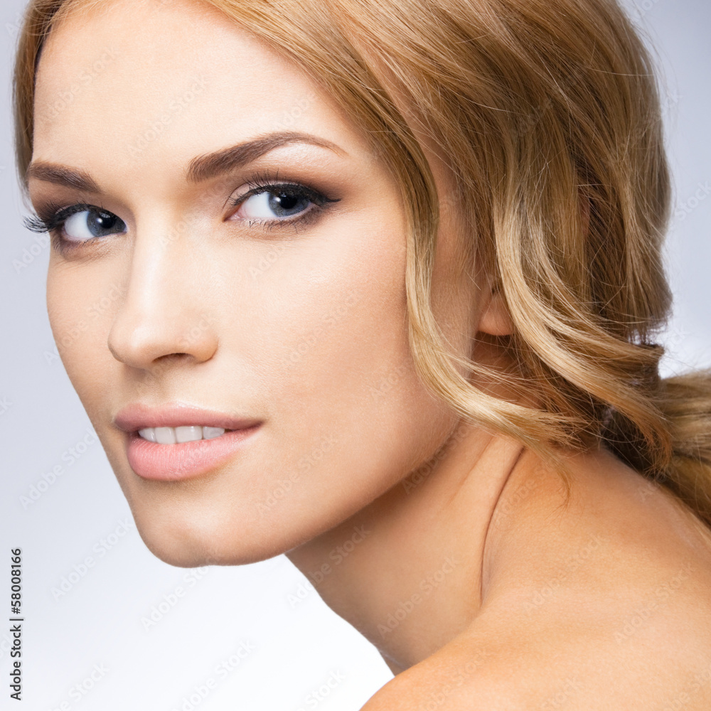 Fototapeta premium Portrait of beautiful woman, over grey