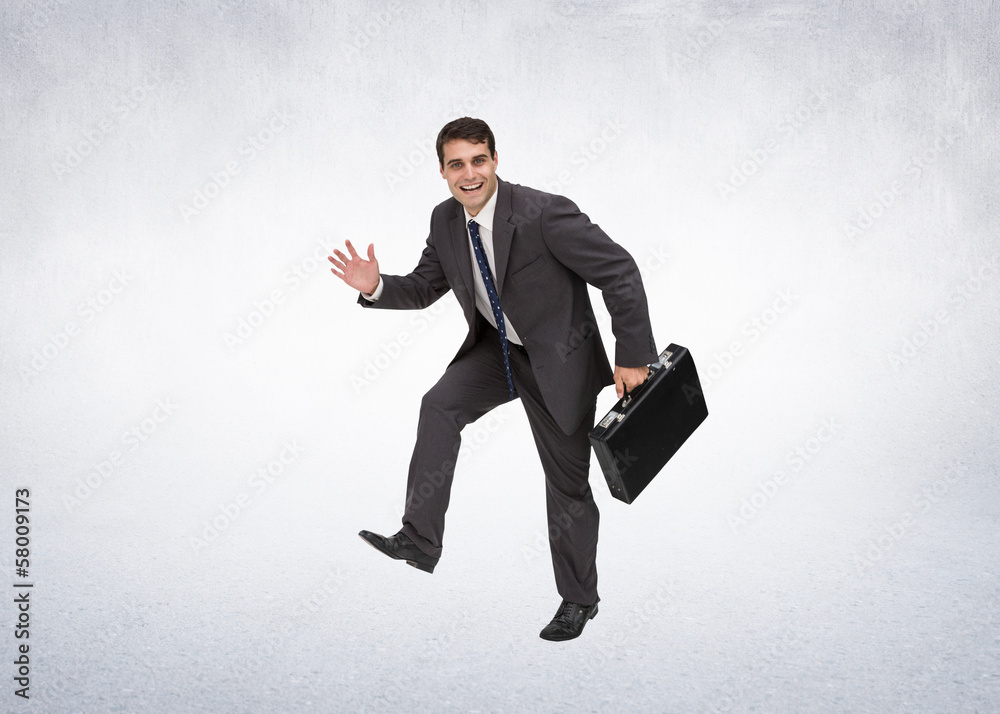 Composite image of cheerful businessman in a hury Composite image of cheerful businessman in a hury