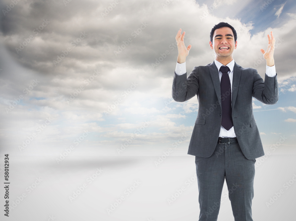 Composite image of stressed businessman with arms raised Composite image of stressed businessman with arms raised