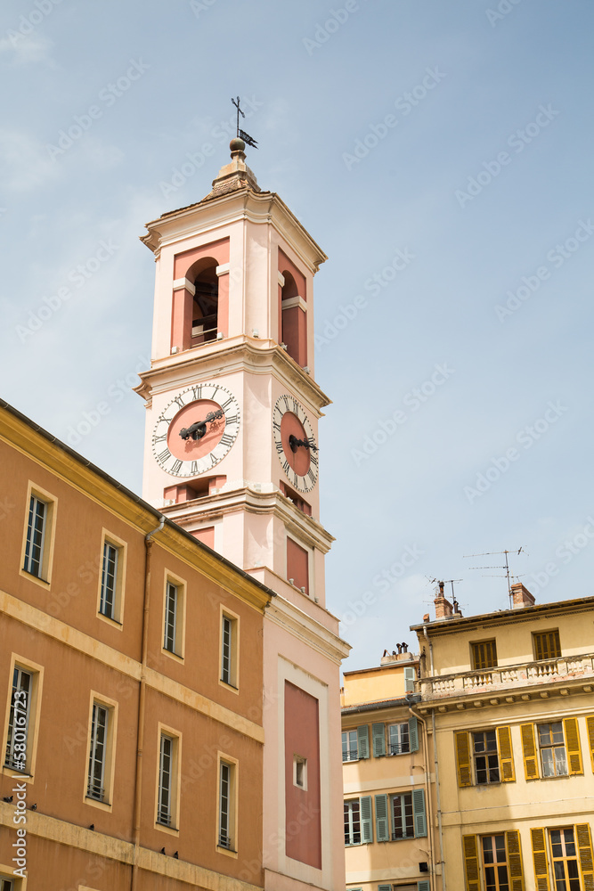 Pink Clock Tower on Yellow Plaster Building
