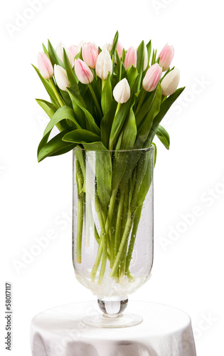 Pink and white tulips bouquet in vase. With path.