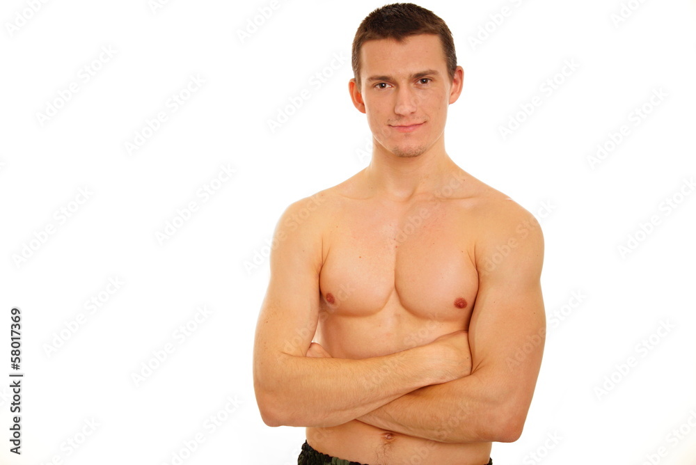 Portrait of young athletic man shirtless with folded hands