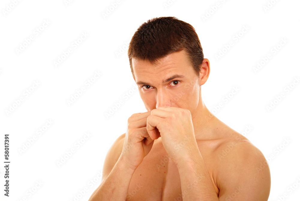 Young athletic man boxes with fist Young athletic man boxes with fist